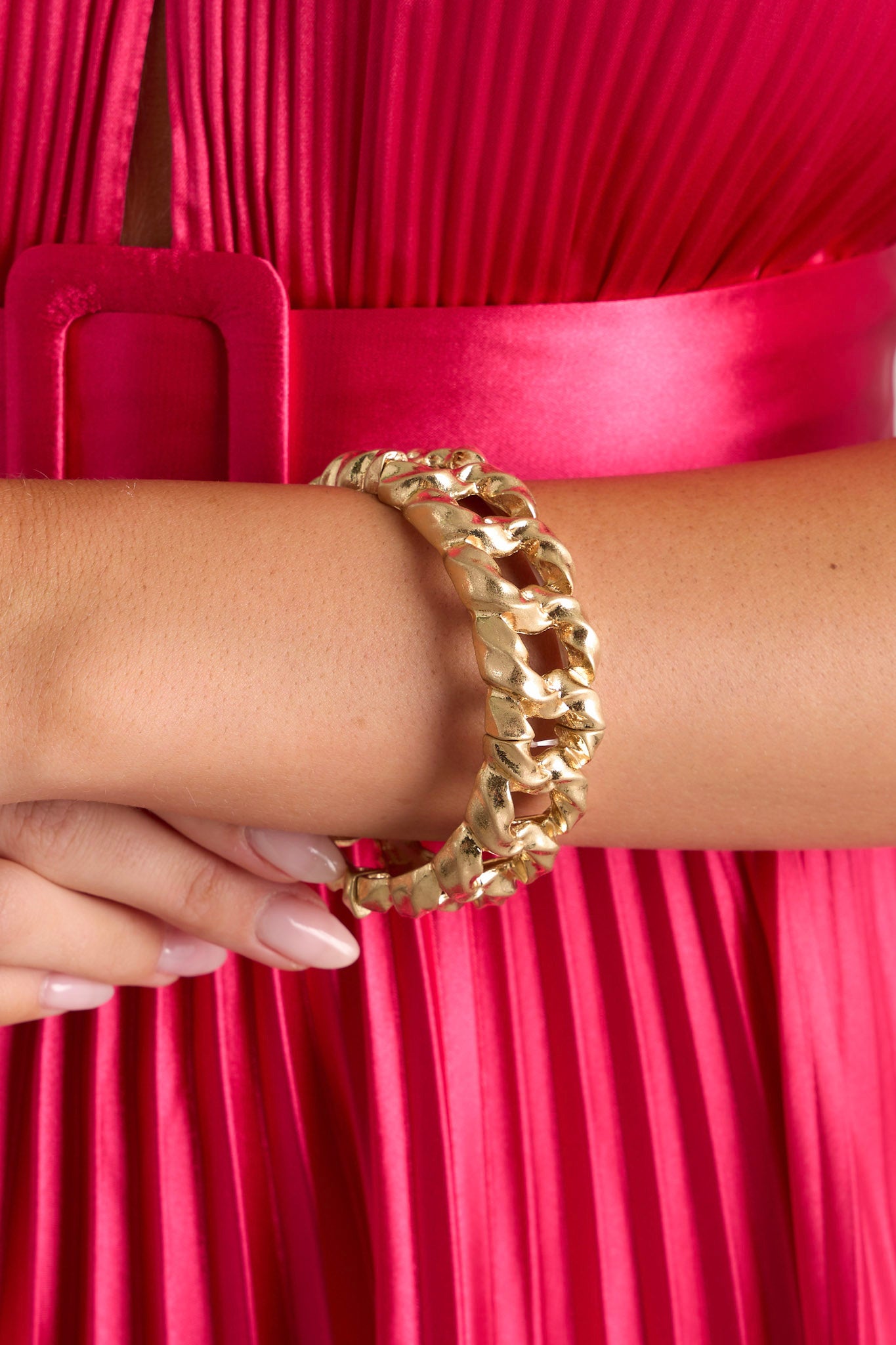 Styled photo of this gold chain bracelet featuring a chain look, elastic bands for stretch as needed and split design.