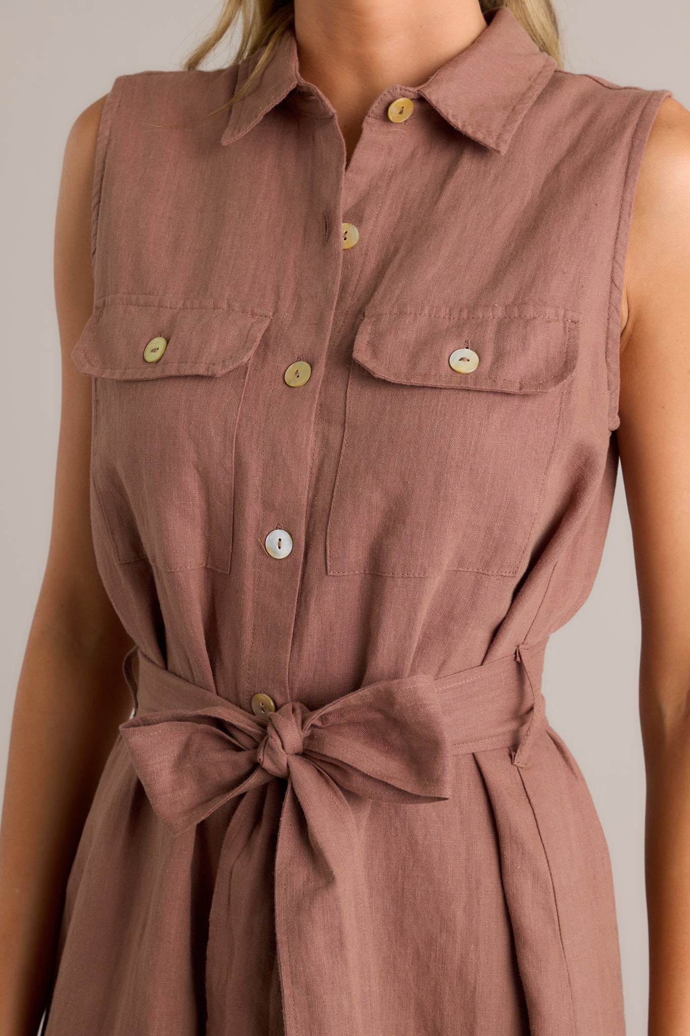 Close-up of the midi dress showing the tie-front belt and button-front design.