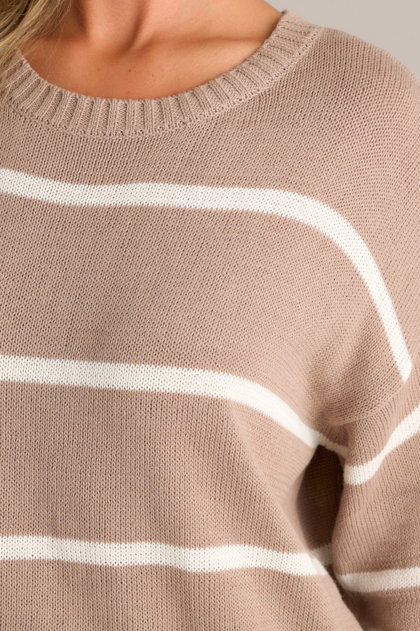 Soft knit fabric in a latte tan stripe pattern with ribbed hems.