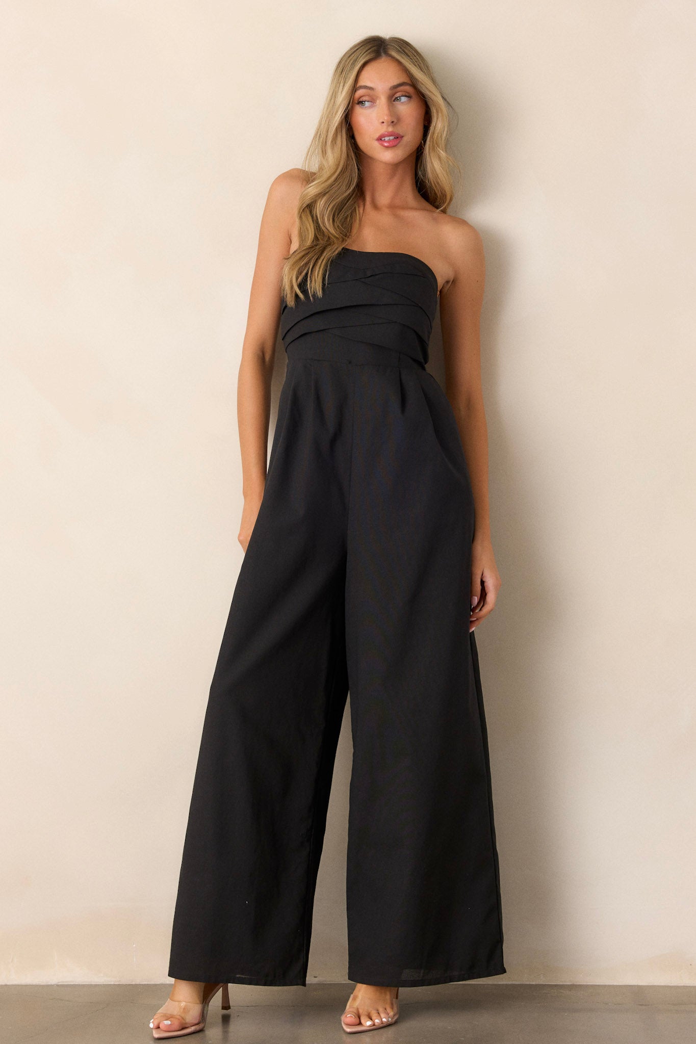 This jumpsuit features a smocked back, wide leg bottoms and a stretchy band on the bust for support.