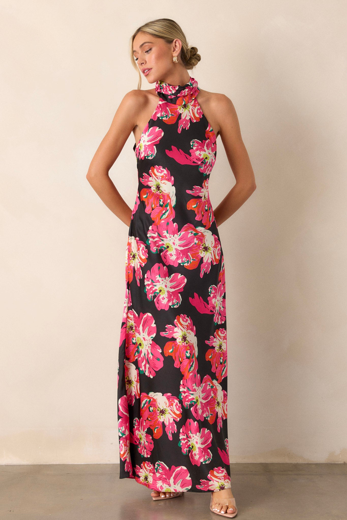 Full length view of a dress featuring a tie halter neck, a functional back zipper closure, and a soft lining