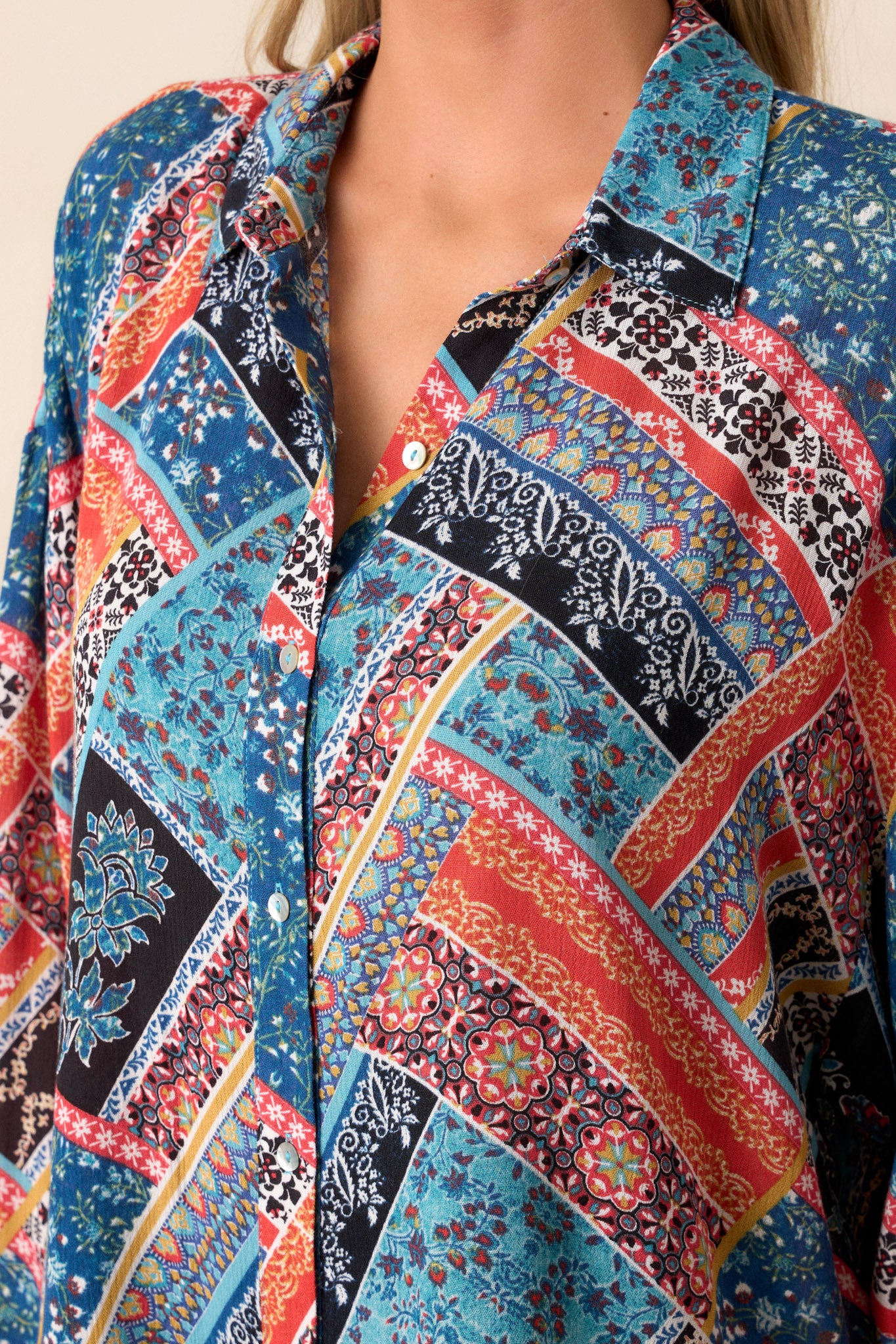 Close-up of the patchwork pattern, highlighting the various fabrics and colors used in the design, emphasizing its unique and fun style.