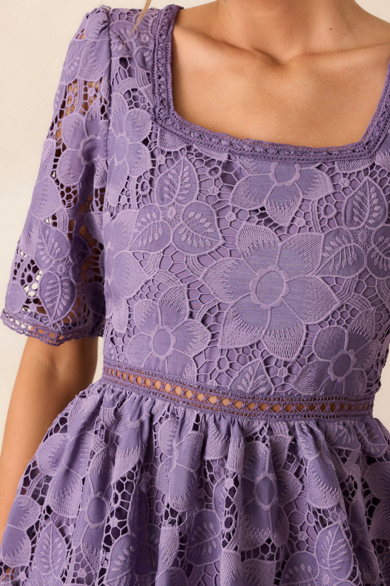 Close-up of the lilac dress focusing on the square neckline, intricate lace floral design, and the lace cutout waist detailing.