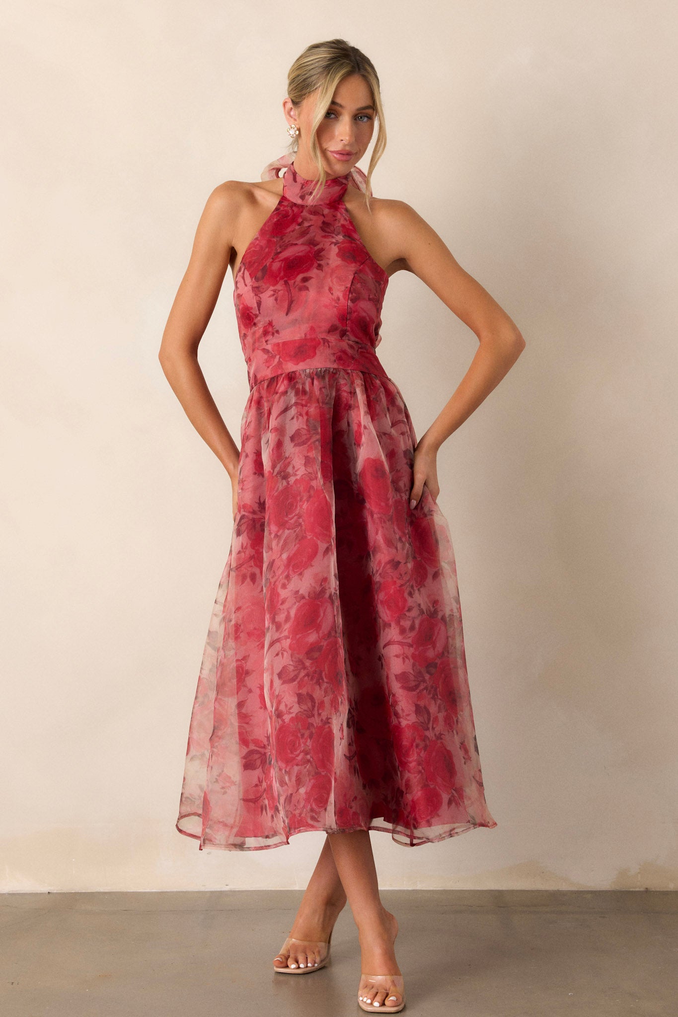 Front view of a red floral dress featuring a halter-neck design with a slight collar, a red floral mesh pattern