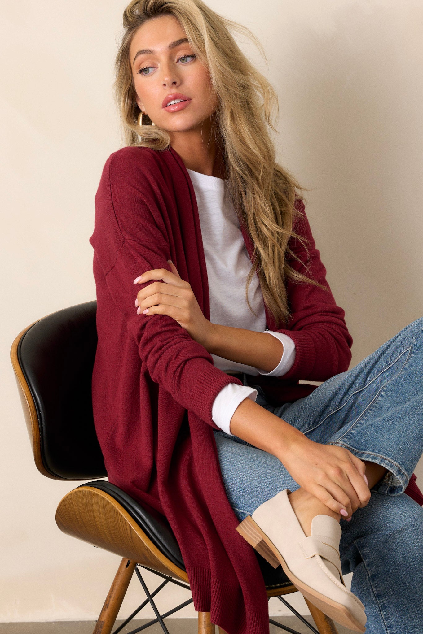 Cardigan features a large slouchy folded collar, ribbed fitted cuffs, and ribbed hemline details.