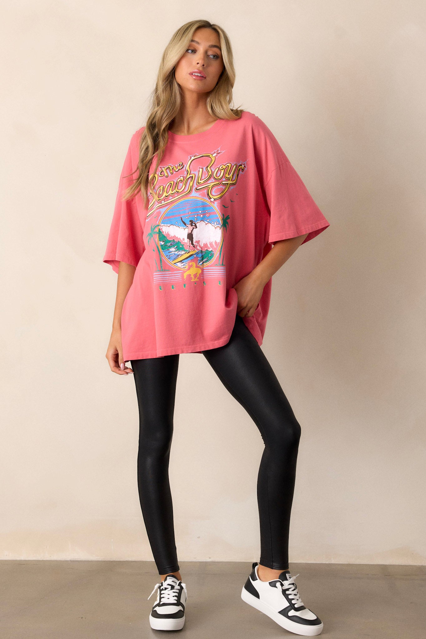 Casual pink t-shirt with a large 'The Beach Boys' graphic, designed in an oversized cut with short sleeves and crew neck