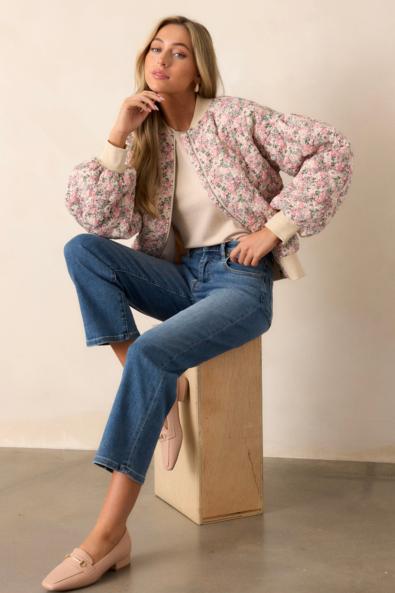 This pink floral jacket features a full zip front, functional waist pockets, a functional zipper pocket on the right sleeve.