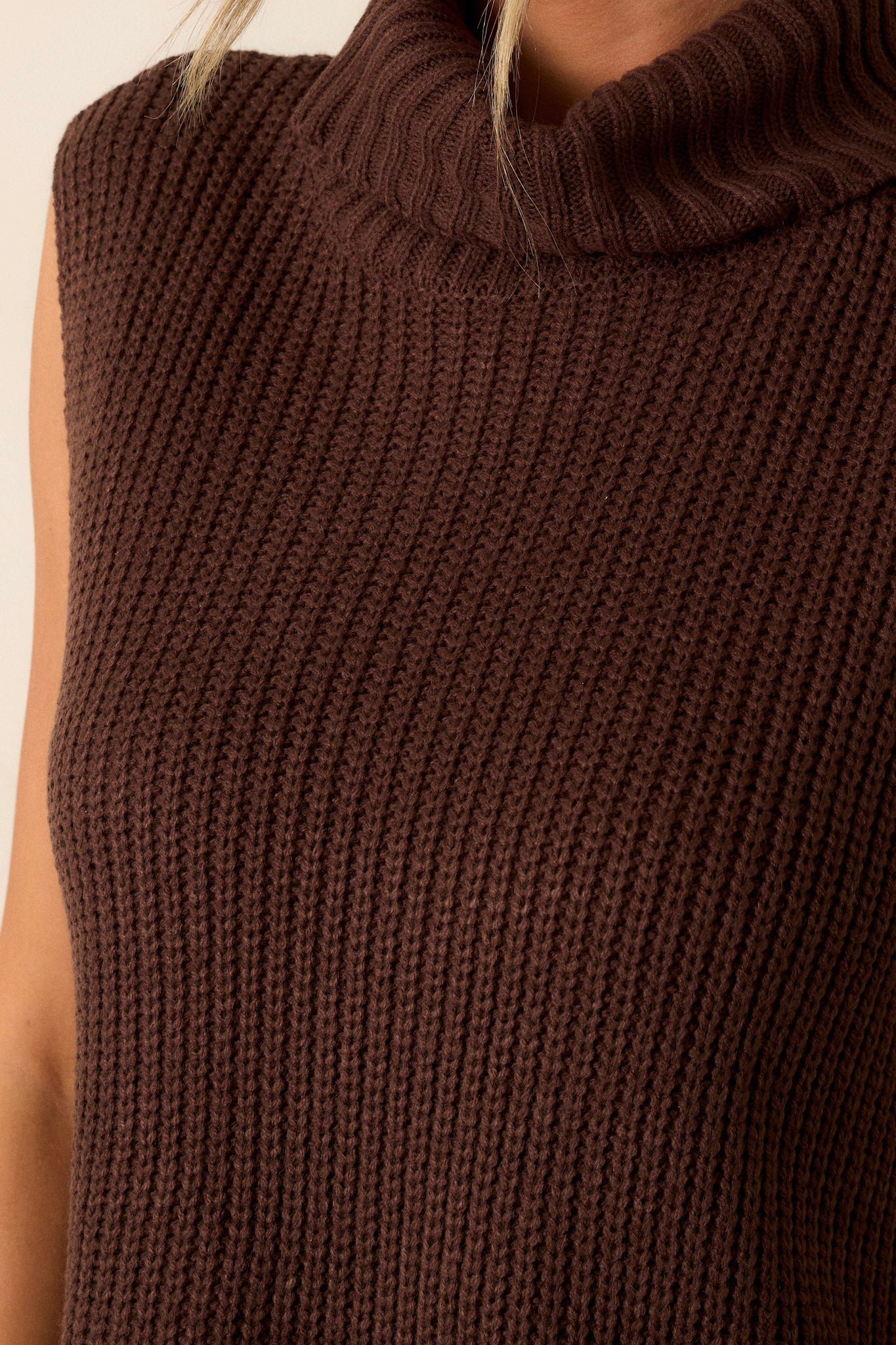 A close-up image focusing on the buttons on the side, showcasing their design and how they complement the sweater.