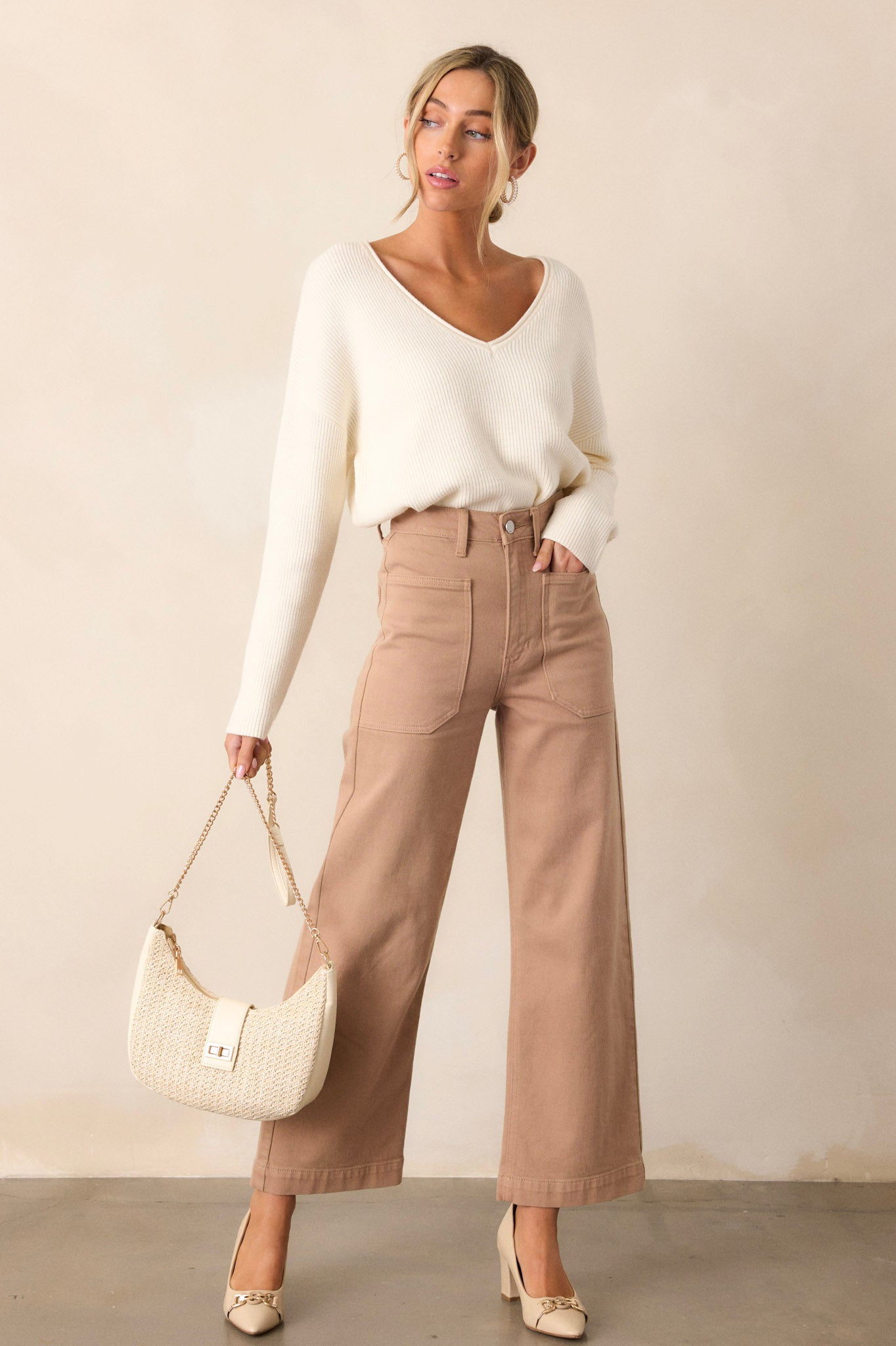 These tan jeans feature a high waisted design, button & zipper closure, belt loops, functional front & back pockets, and a wide leg.