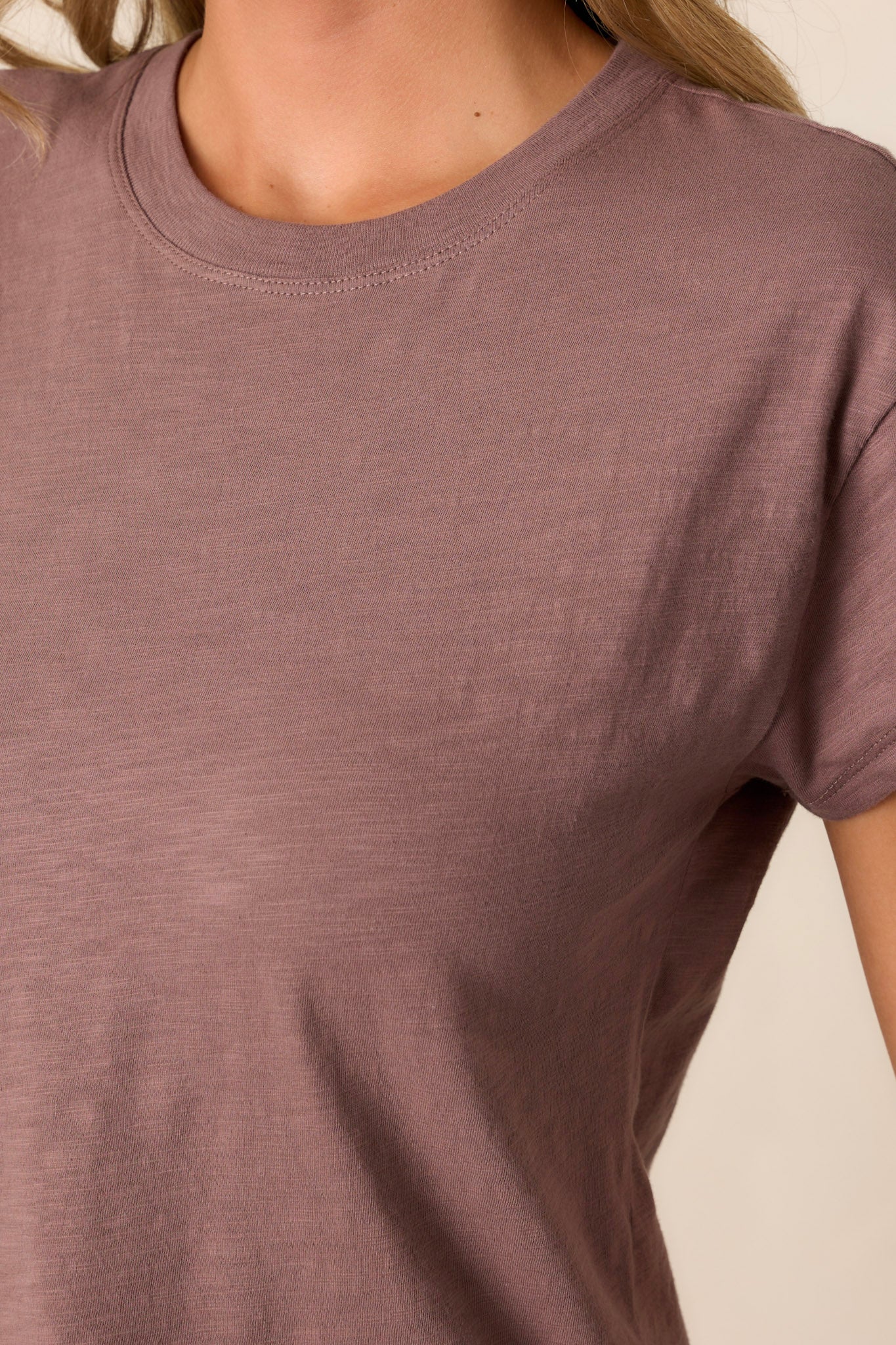 Close-up of the taupe tee focusing on the crew neckline and the soft, lightweight jersey material