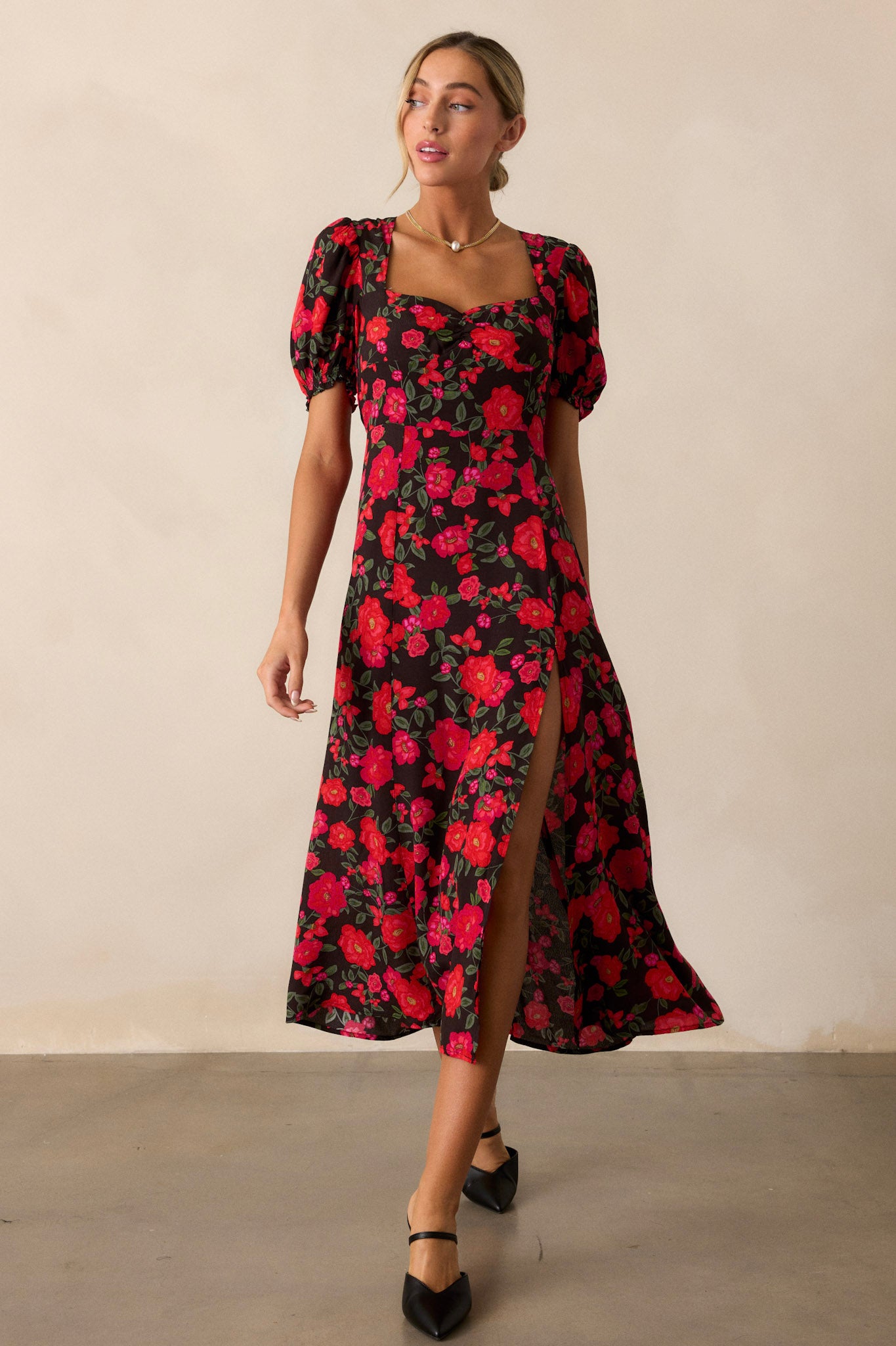 Another angle of the full-length dress, focusing on the overall silhouette and the combination of the floral print with the fitted design.