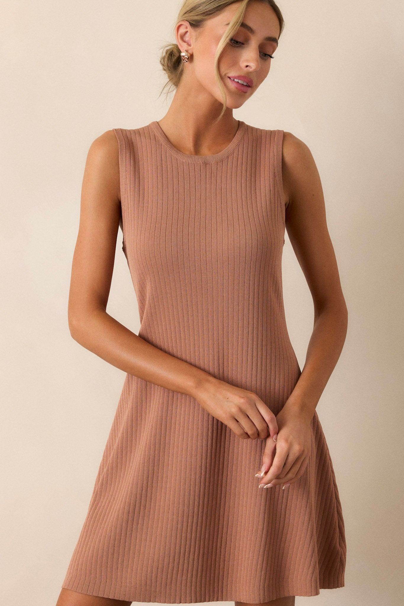 A cropped view focusing on the rounded neckline, showcasing the smooth finish of the fabric and the elegant cut.