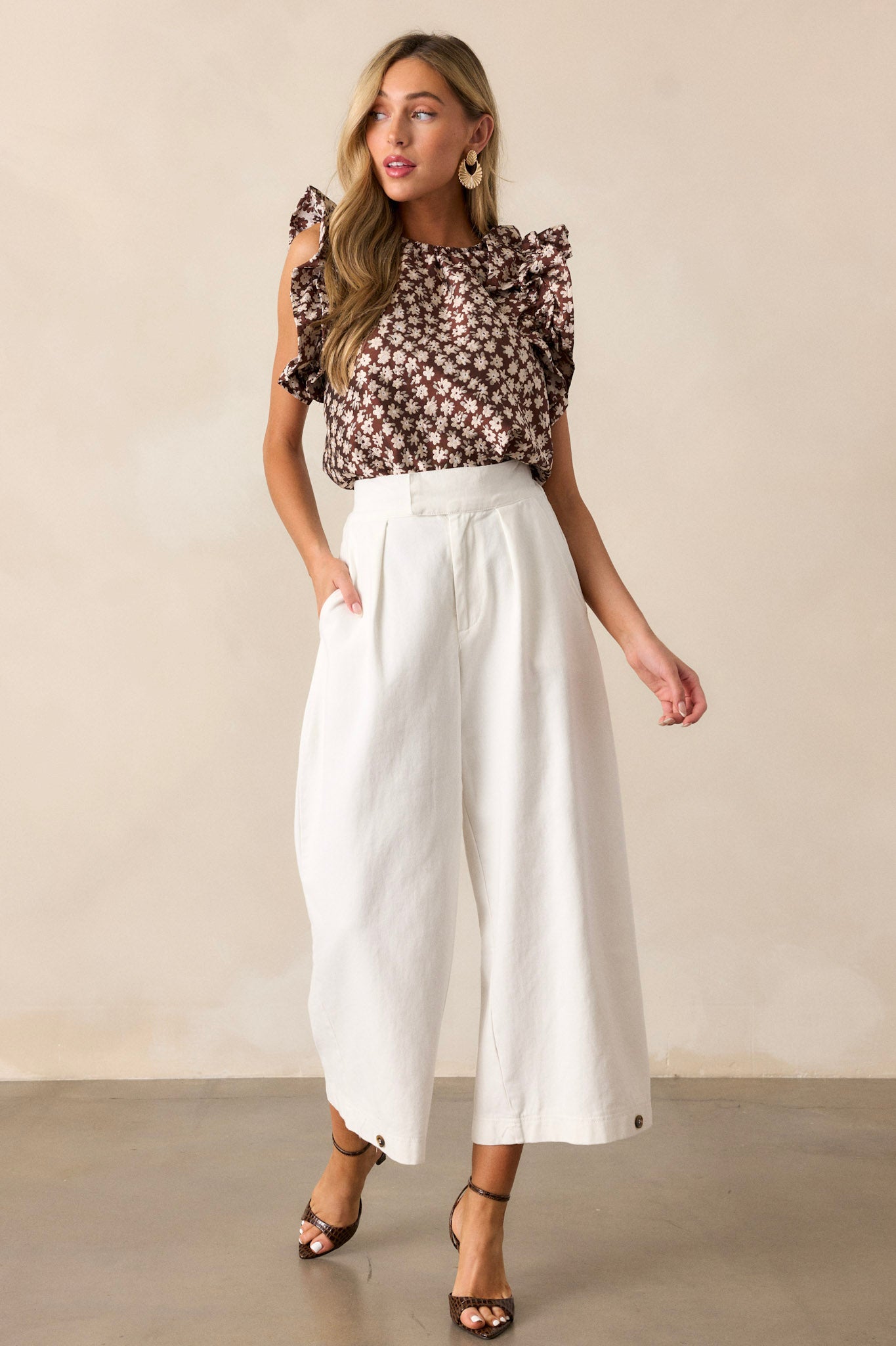 A full-length view of the pants, showcasing the high-waisted design and wide leg silhouette that creates a chic and sophisticated look.