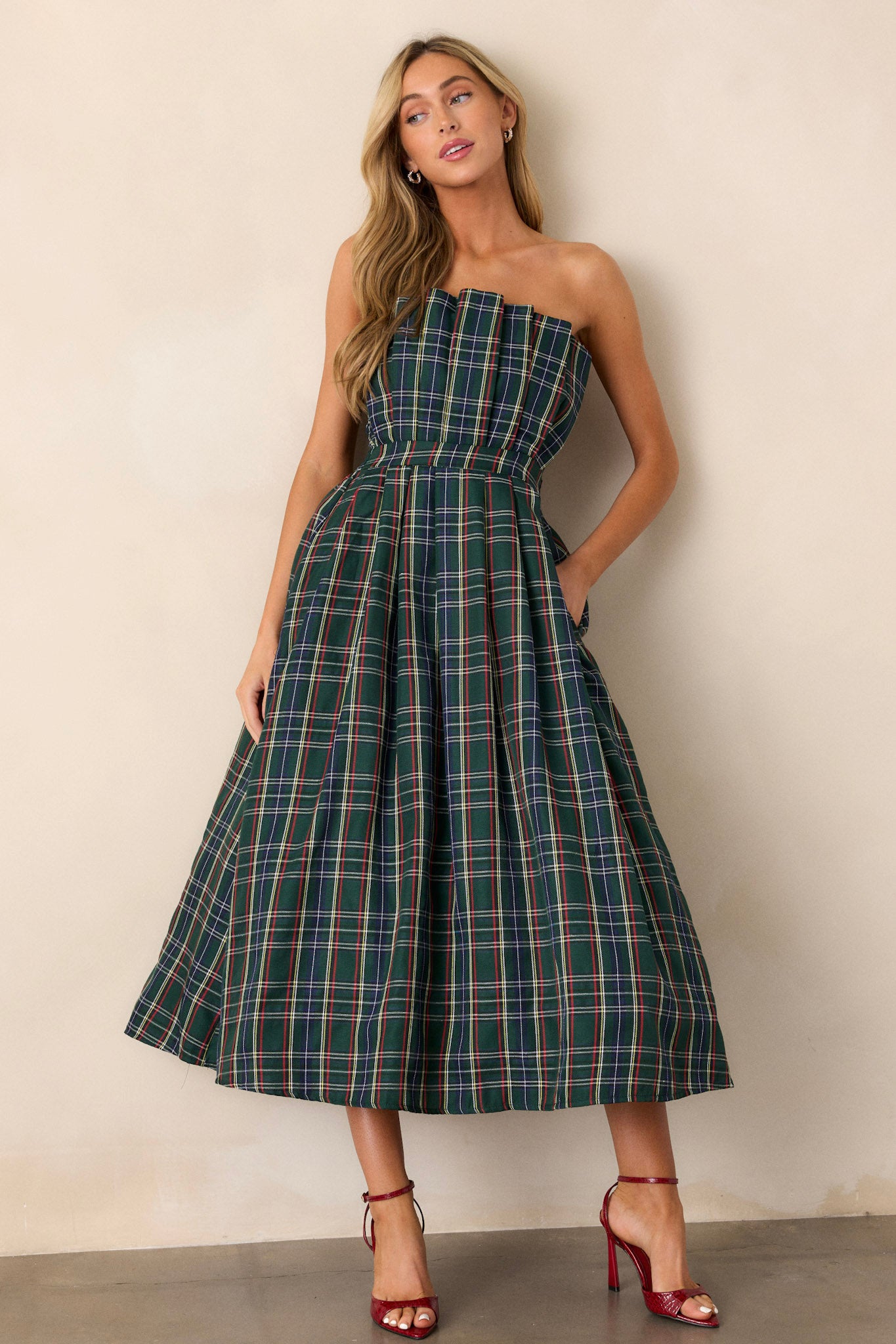 A complete shot highlighting the slightly pleated skirt, allowing the dress to flow gracefully, while the functional hip pockets add practicality.