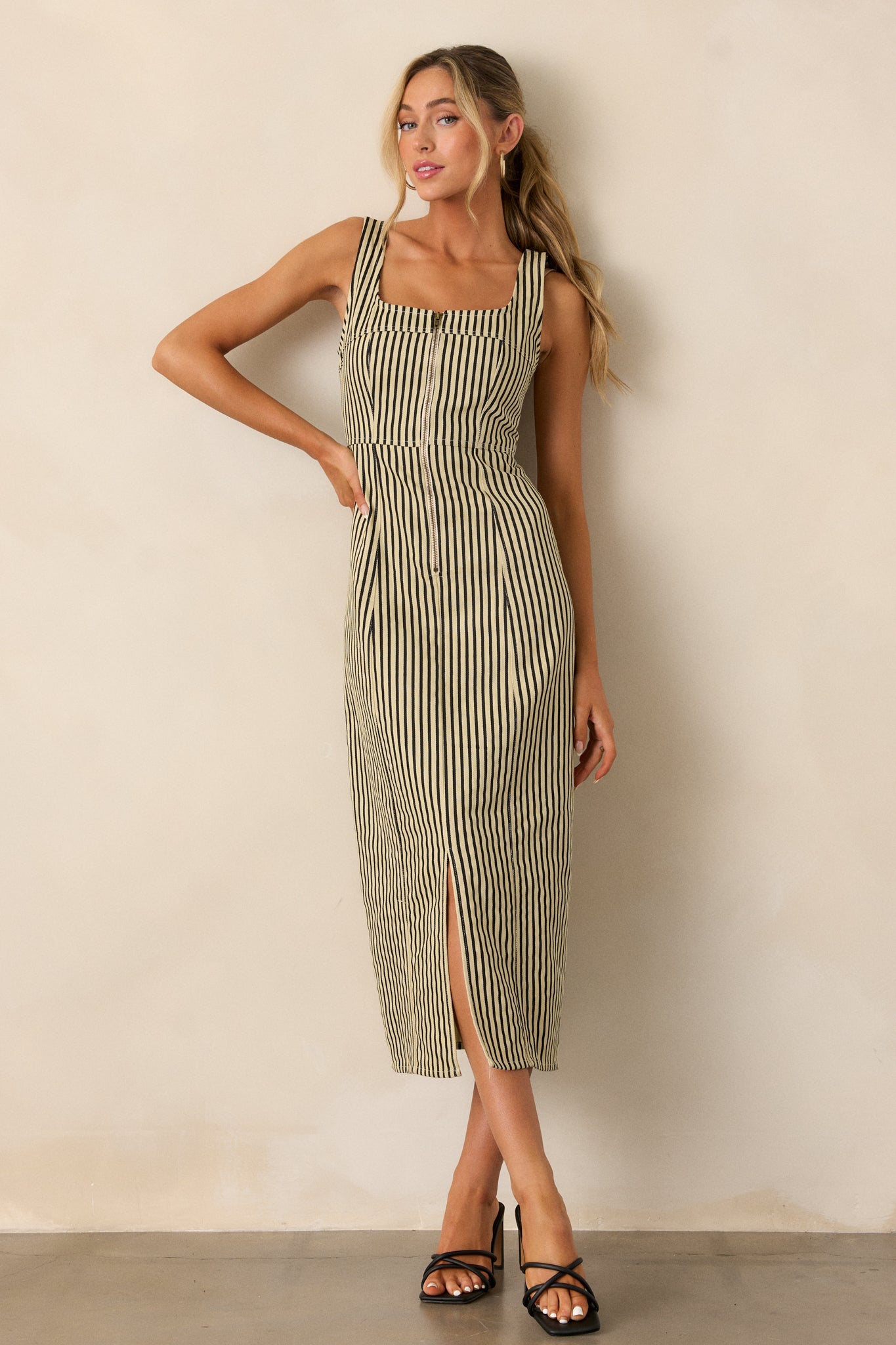 Full-length shot focusing on the square neckline and vertical stripe design, with the front slit visible.