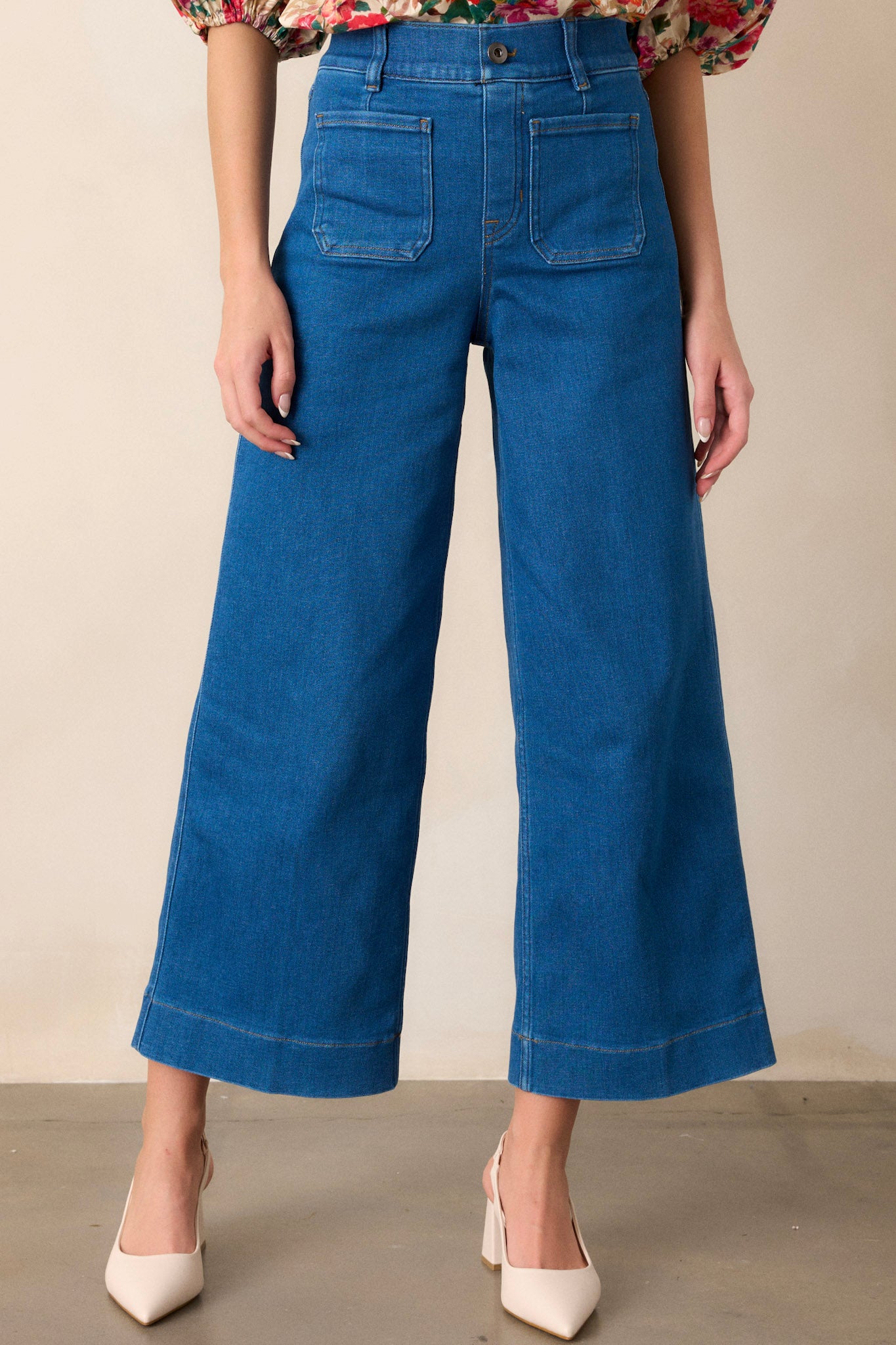 Front view of these jeans that feature a cropped length, a pull on design, functional belt loops, and two front patch pockets.