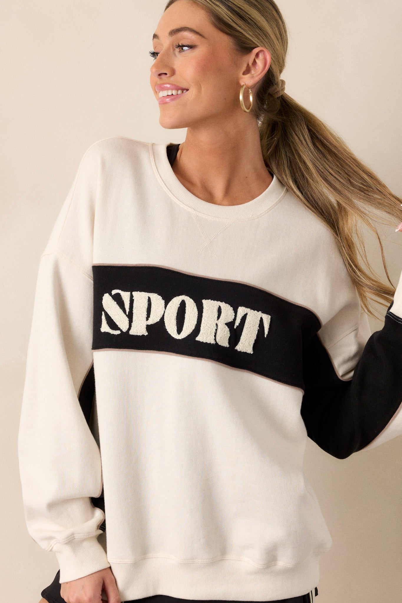  A cropped shot of one sleeve, emphasizing the ribbed cuff and the contrasting color blocking that enhances the sleeve design.