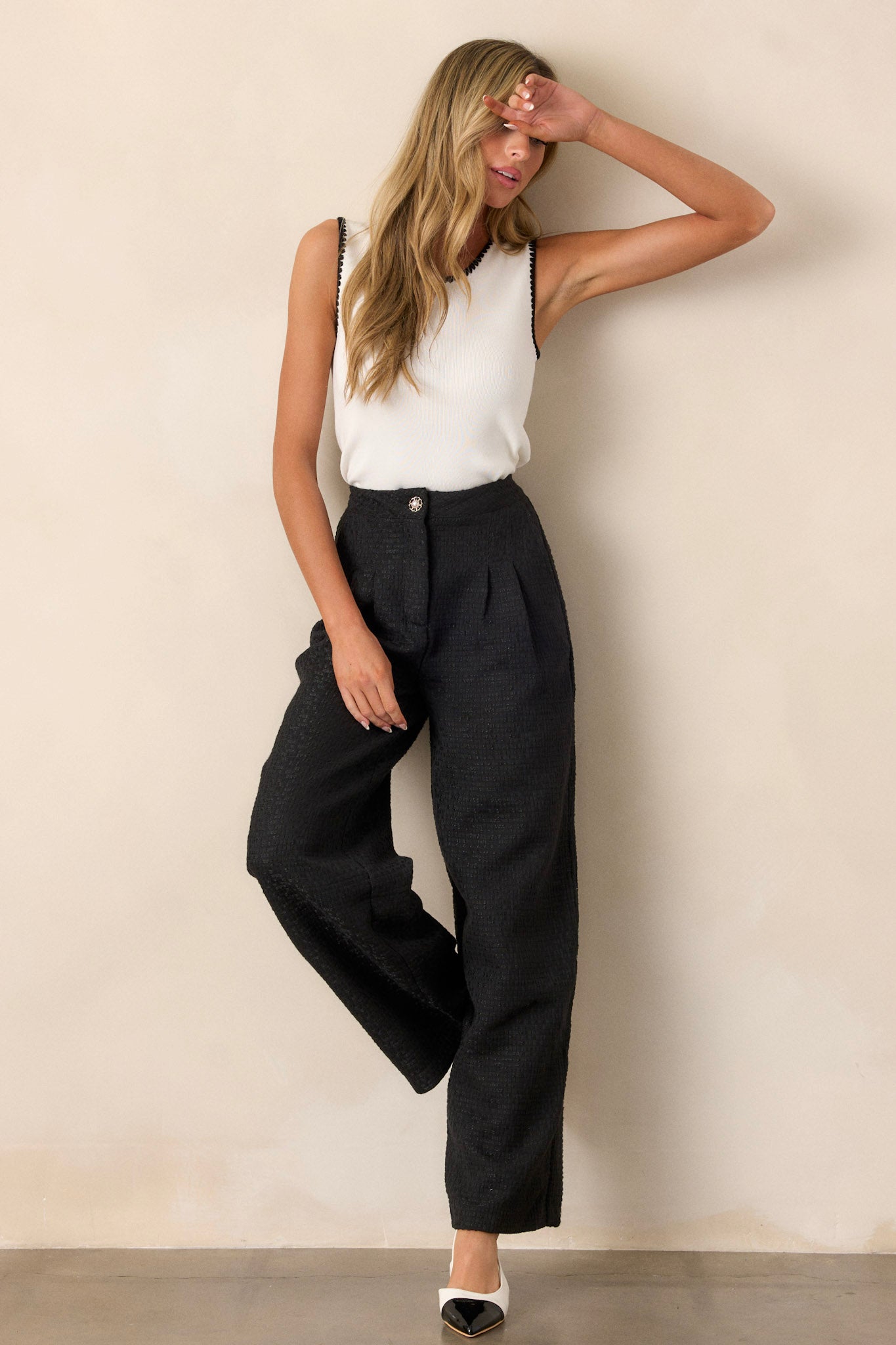 These pants feature two front pockets and a bedazzled front closure button.