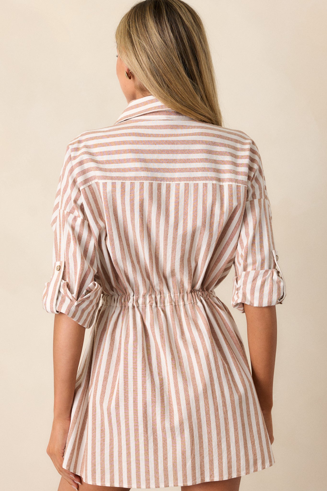 Back view of the stripe mini dress, displaying the collared neckline from behind and the continuous striped pattern across the back.





